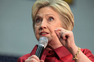 Hillary Clinton speaking into Microphone